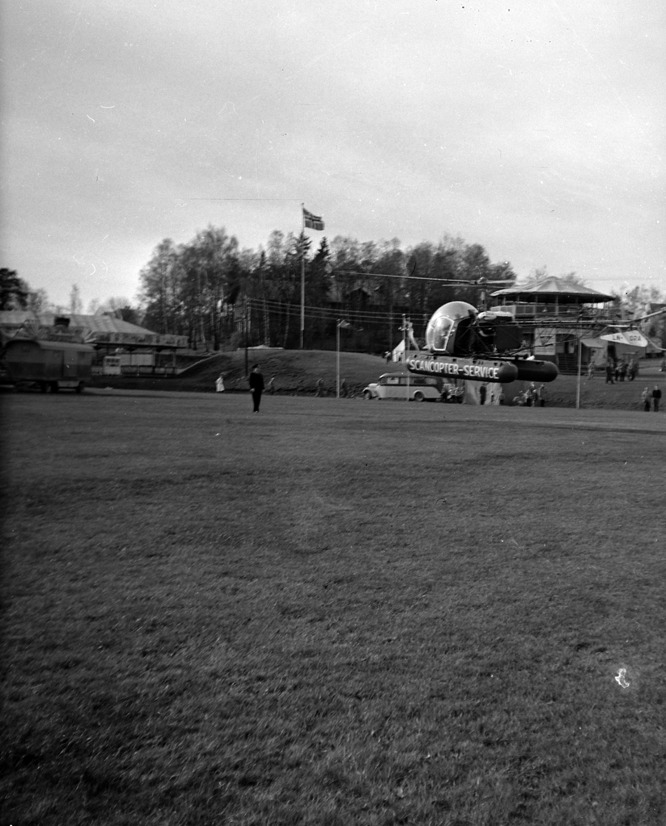 Adolf Skjegstad, SCANCOPTER SERVICE, HELIKOPTER PÅ UTSTILLINGSPLASSEN I HAMAR. Helikopteret er en Bell 47D-1