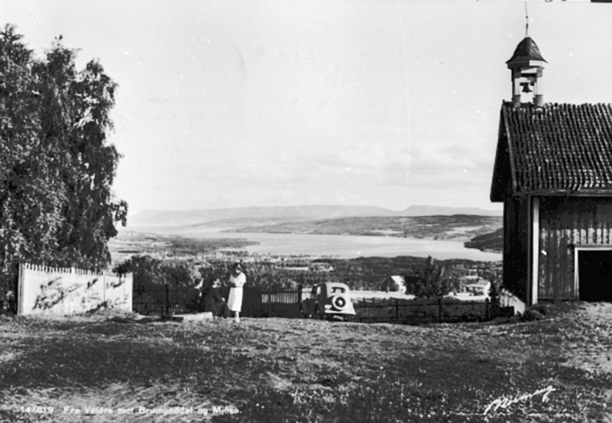 Anno Domkirkeodden, Utsikt fra Storlien gård, Veldre, Ringsaker mot Brumunddal og Mjøsa. Stabbur.