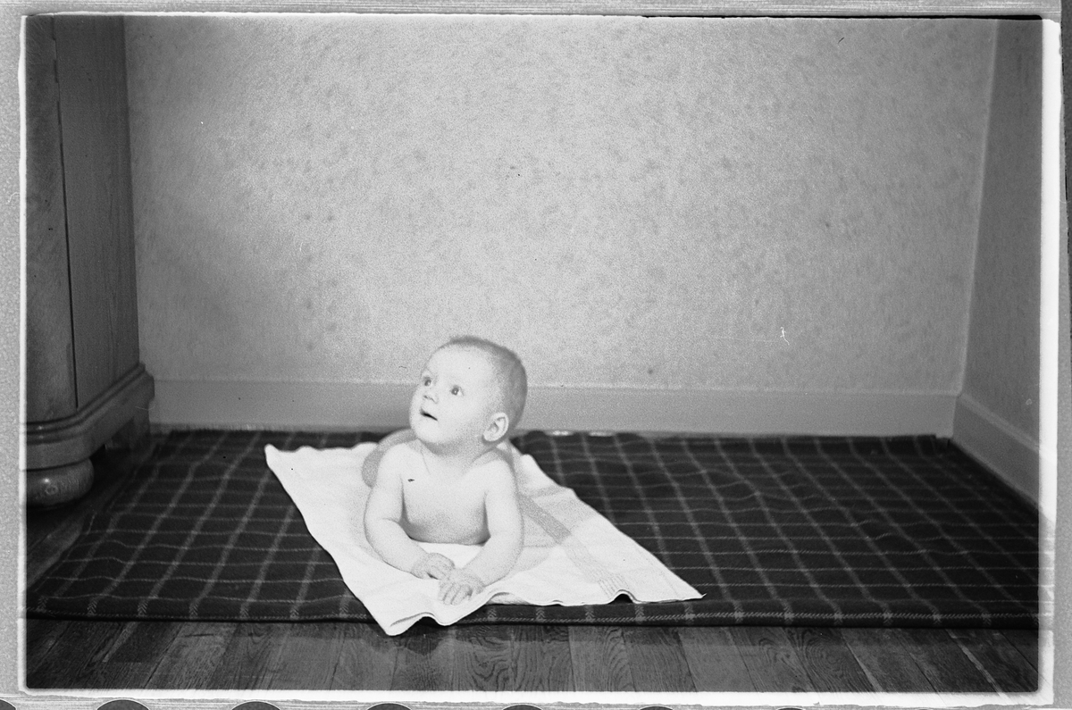Håkon Prestkværn, En baby på et pledd.