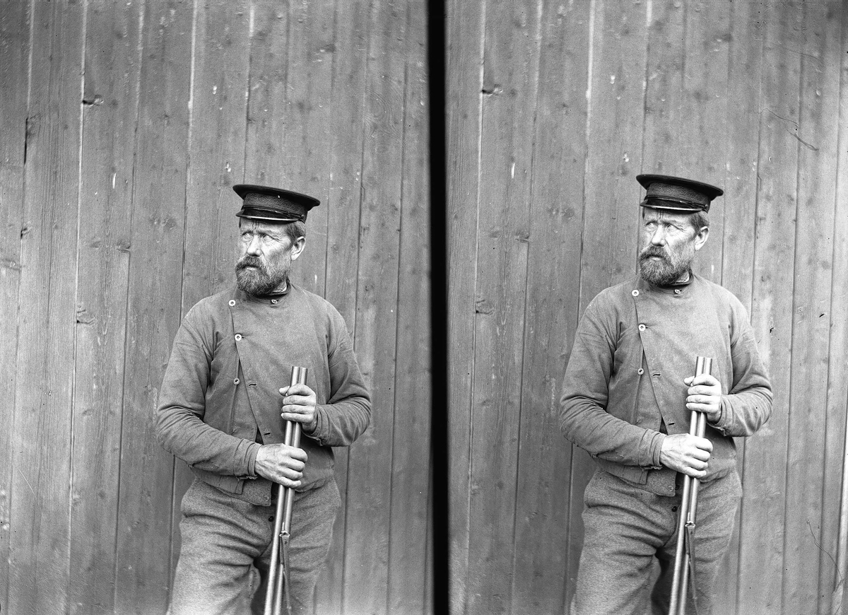 Axel Quinsgaard Wiborg, Portrett av Gulbrand med hagle på Holoa seter, Hadeland, Jevnaker, Oppland, 1906.