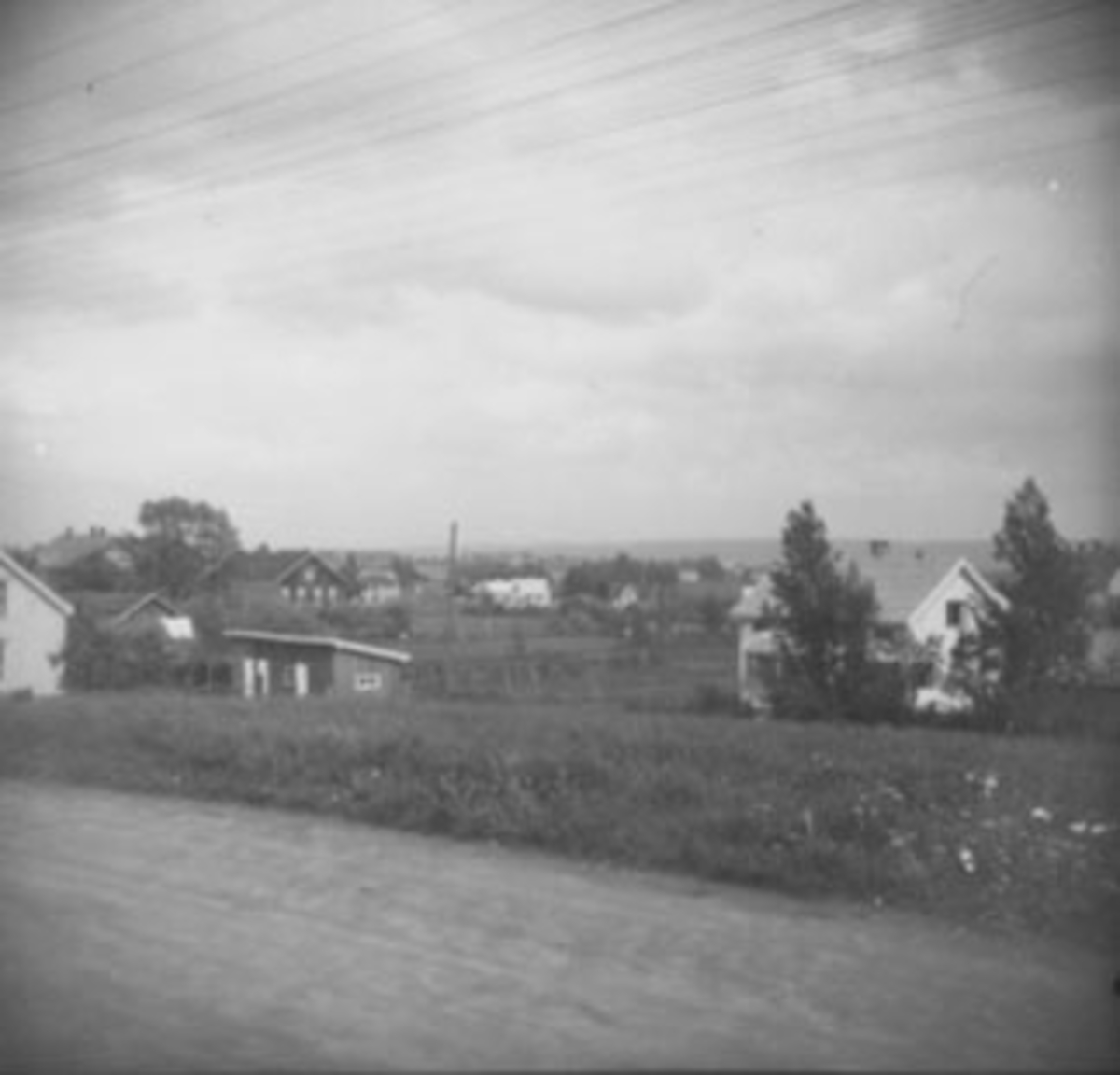Anno Domkirkeodden, RIKSVEG 222, SENTRUMSKVARTALET TIL HØYRE. , VOLLA I BAKGRUNNEN TIL VENSTRE. ,